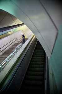 Man standing on steps at subway station