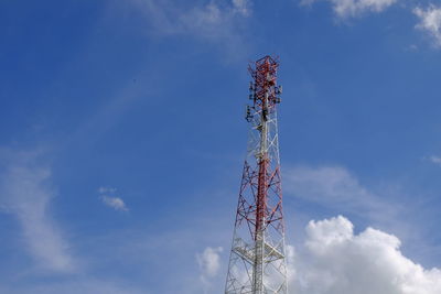 Low angle view of communications tower against sky