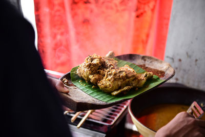 Close-up of man holding in plate