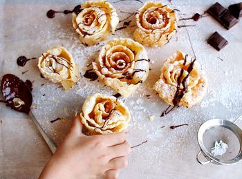 Cropped hand of person holding sweet food