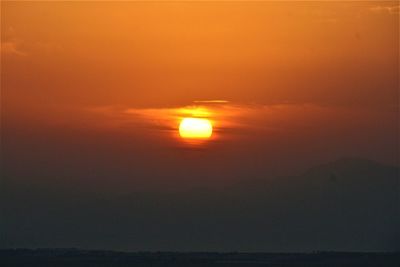 Scenic view of sea against romantic sky at sunset