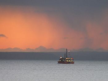 Silhouette of boats at sunset