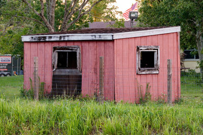 Exterior of abandoned house on field