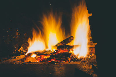Bonfire on log at night