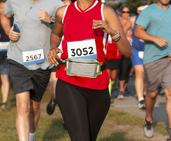 Rear view of people running