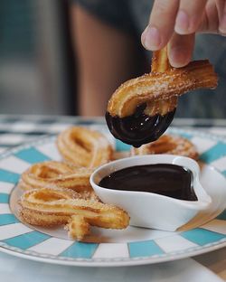 Close-up of hand holding pastry