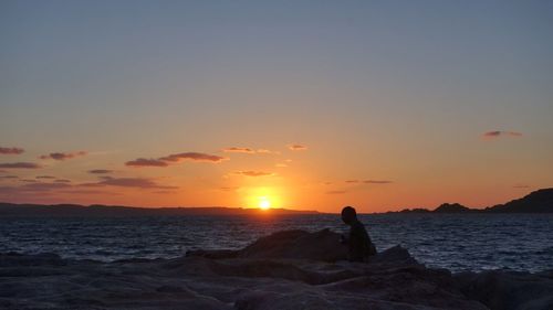 Scenic view of sea at sunset
