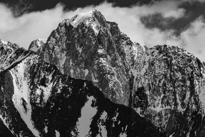Low angle view of rock formation against sky