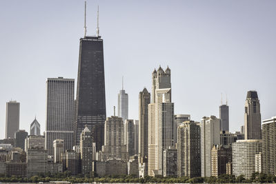 Skyscrapers in city against clear sky