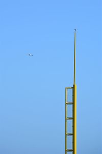 Low angle view of airplane flying in sky