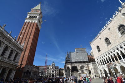 Low angle view of buildings against blue sky