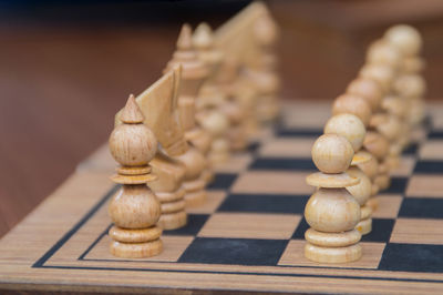 Close-up of chess pieces on table