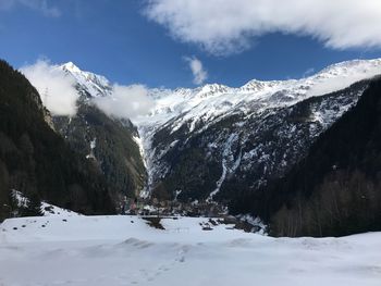 Scenic view of snowcapped mountains against sky