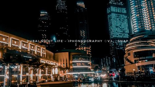 Illuminated buildings in city at night