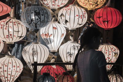 Rear view of people at market stall