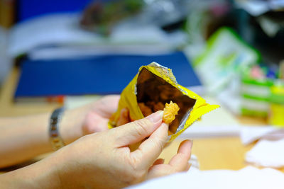 Close-up of hand holding food