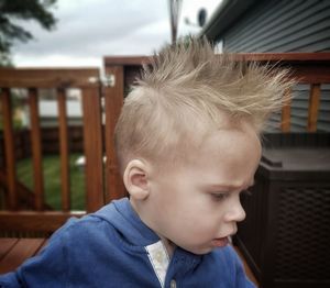 Close-up of cute boy with spiky hair