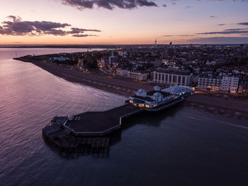 High angle view of boats in sea against sky during sunset