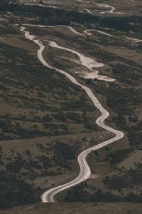 High angle view of road passing through land