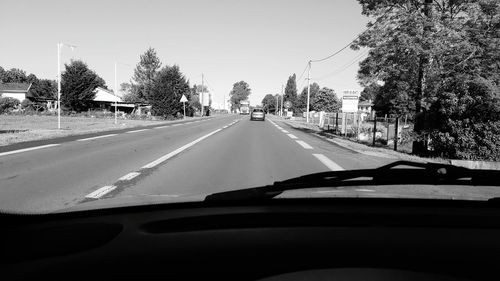 Road passing through car windshield