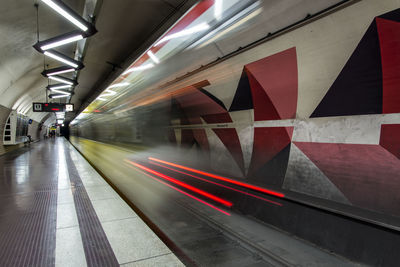 Blurred motion of train at subway station