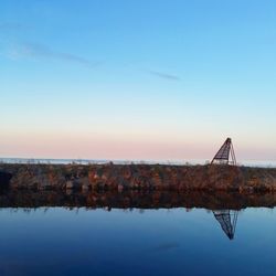 Scenic view of lake against clear blue sky