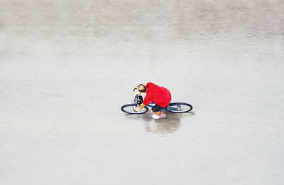 High angle view of man riding bicycle on street