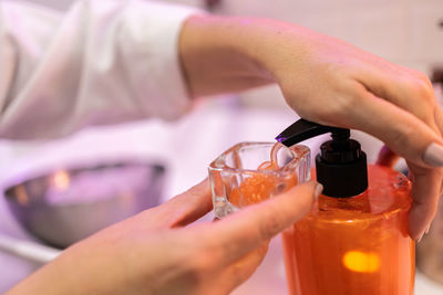 Cropped hand of person washing hands