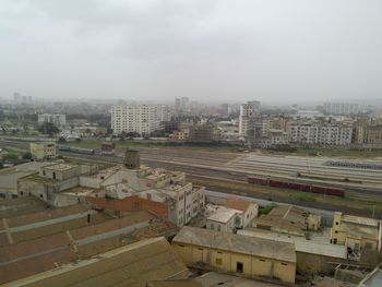 High angle view of buildings in city against sky