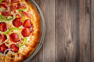 Directly above shot of pizza served on table