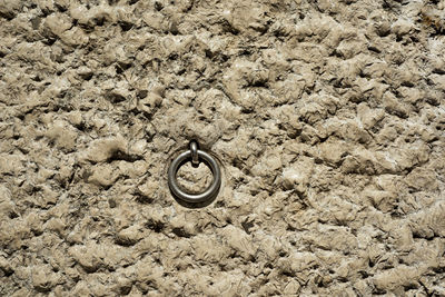 High angle view of manhole on rock