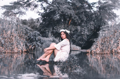 Portrait of young woman in forest