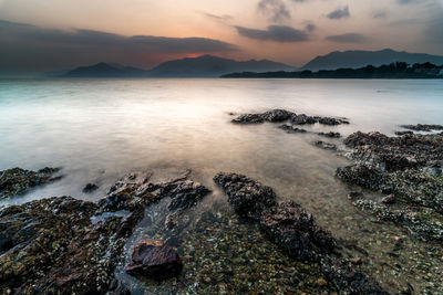 Scenic view of sea against sky during sunset