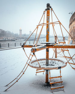 View of frozen river against sky during winter