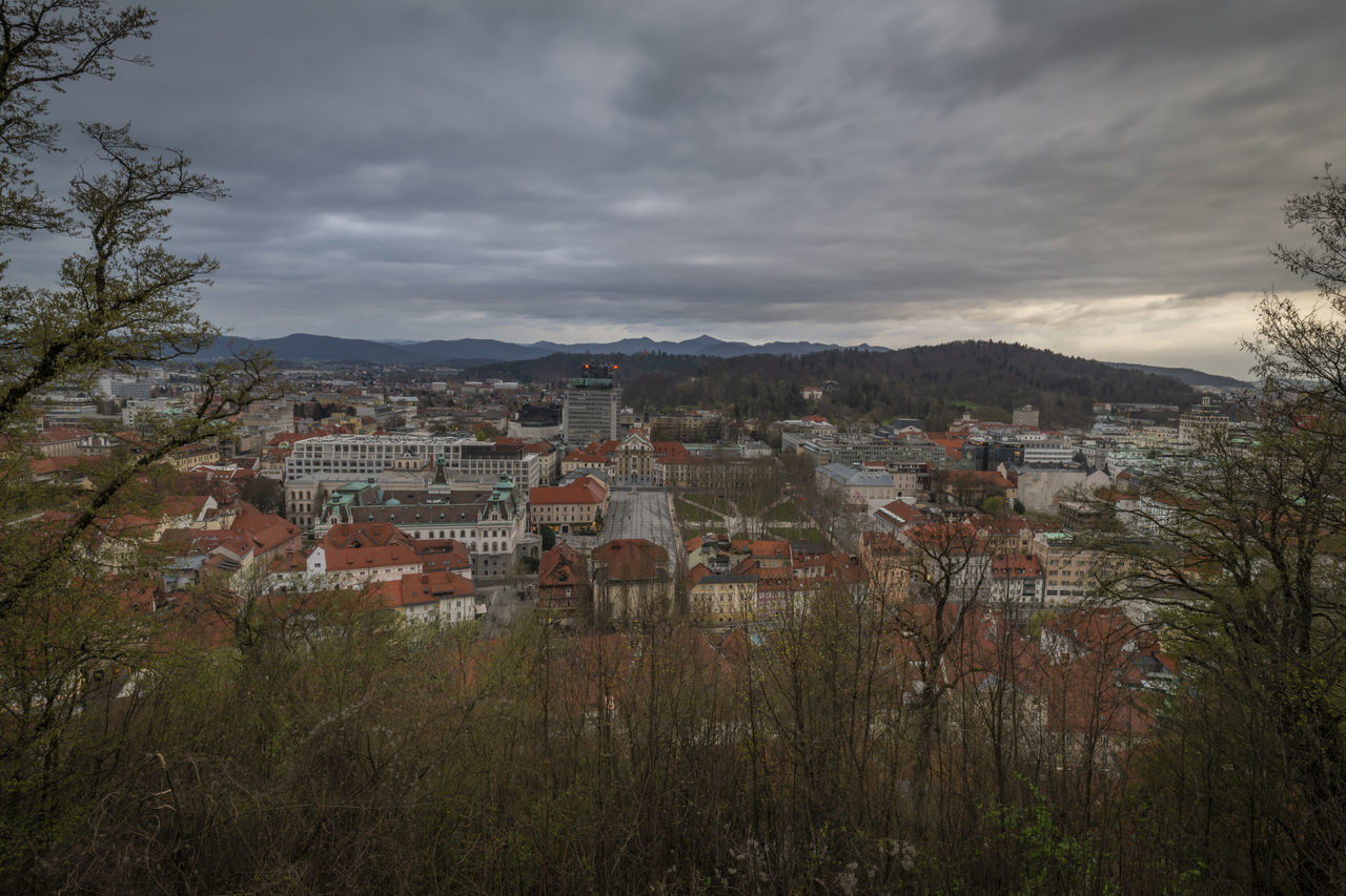 architecture, building exterior, building, built structure, sky, cloud, city, plant, tree, residential district, nature, hill, rural area, house, landscape, morning, no people, cityscape, environment, land, town, outdoors, travel destinations, high angle view, autumn, community, travel, tourism, scenics - nature, village