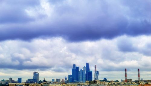 Buildings in city against sky