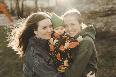 Portrait of mother and daughter outdoors