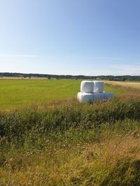 Built structure on field against clear sky