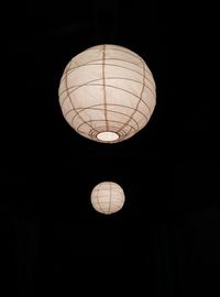 Low angle view of light bulbs hanging on ceiling