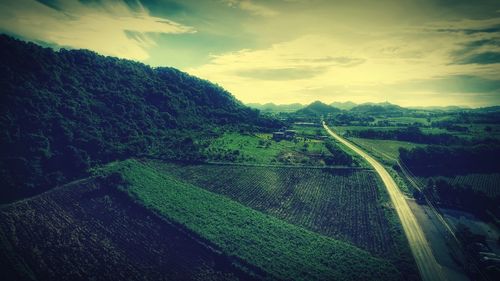 High angle view of road by mountain against sky