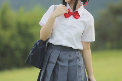 Woman standing on field