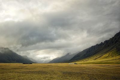 Scenic view of landscape against dramatic sky