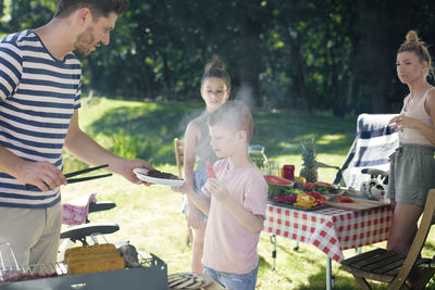 Group of people at restaurant on barbecue grill