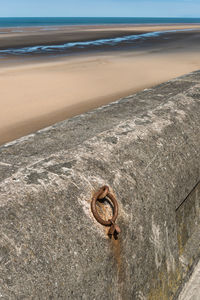 Close-up of rusty metal on beach