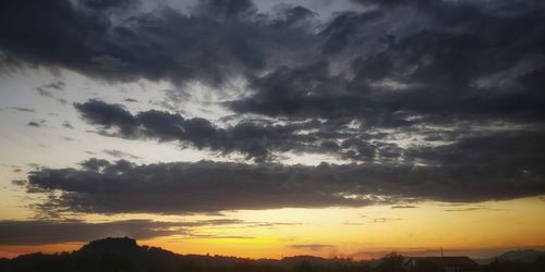 Low angle view of dramatic sky during sunset
