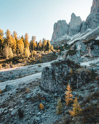 Scenic view of rocky mountains against sky during autumn