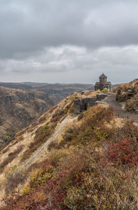 Scenic view of landscape against cloudy sky