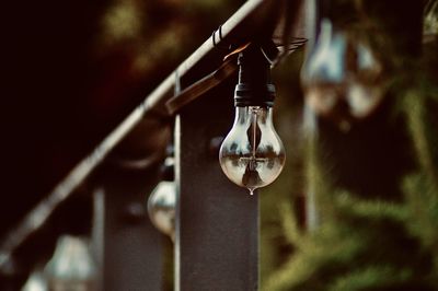 Close-up of hanging light bulb 