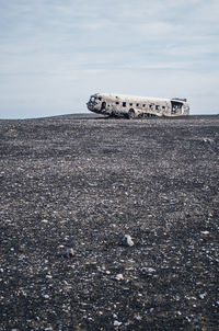 Scenic view of crashed airplane in iceland on seashore