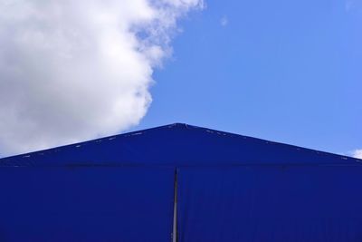 Low angle view of built structure against blue sky